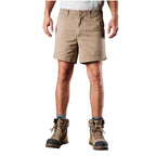 A man modelling a pair of khaki FXD Men's WS-2 Work Shorts (FX01136005) paired with grey socks, and stone FXD work boots against a plain white background.