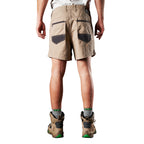 A back view of a man modelling a pair of khaki FXD Men's WS-2 Work Shorts (FX01136005) paired with grey socks, and stone FXD work boots against a plain white background.