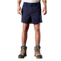 A man modelling navy blue FXD Men's WS-2 Work Shorts (FX01136005), paired with grey socks, and stone FXD work boots, shown from the waist down on a plain white background.