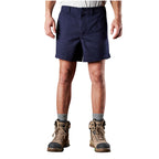 A man modelling navy blue FXD Men's WS-2 Work Shorts (FX01136005), paired with grey socks, and stone FXD work boots, shown from the waist down on a plain white background.