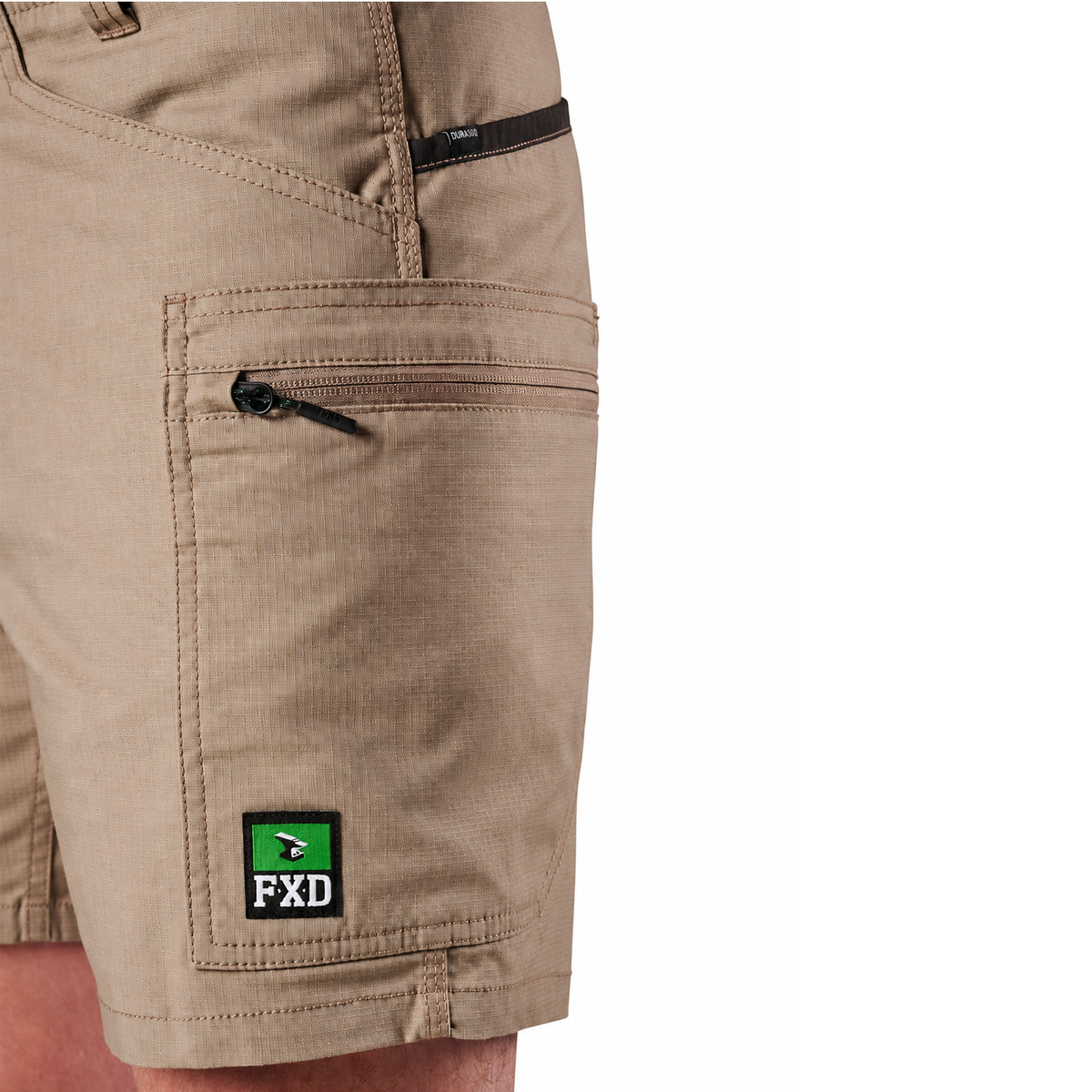 A close-up of khaki FXD Men's WS-6 Work Shorts (FX02306021, showing  pocket detailing, with a white background on the right.