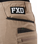 A close-up of khaki FXD Men's WS-6 Work Shorts (FX02306021, showing  pocket detailing, with a white background on the right.