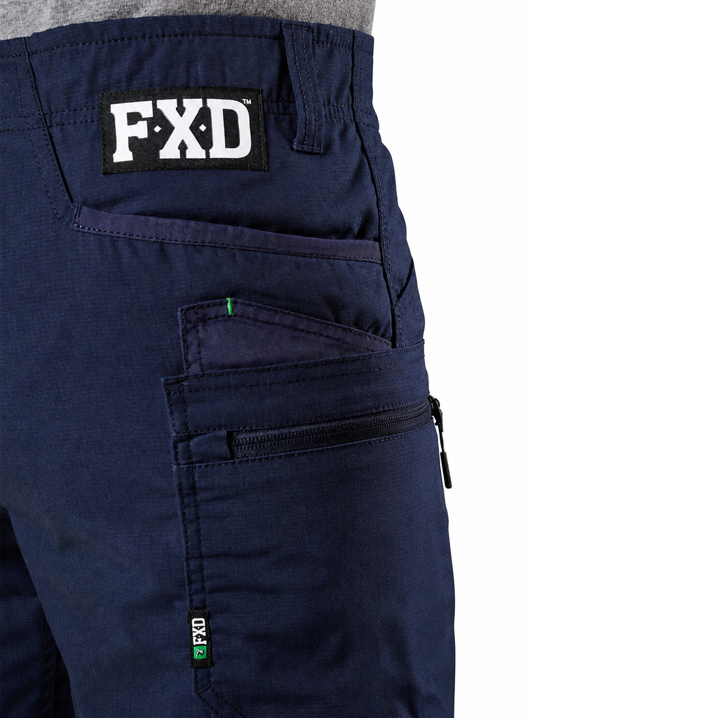 Close-up of navy FXD Men's WS-6 Work Shorts (FX02306021, showing  pocket detailing, with a white background on the right.