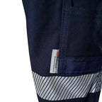 A close up of the detail of navy blue FXD WP-3T Reflective Stretch Work Pants (FX01906010) with reflective silver stripes on the thighs and lower legs, against a white background.
