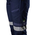 A close up view of the pocket detail and reflective stip on a pair of navy blue FXD Women's Cuffed Taped Work Pants (WP-8WT) against a plain white background.