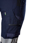 A close up view of the pocket and reflective strip detail of a pair of navy blue FXD Women's Cuffed Taped Work Pants (WP-8WT) against a plain white background.