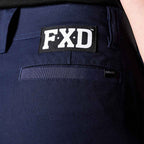 A close up view of the back waist of a pair of navy blue FXD Women's Cuffed Taped Work Pants (WP-8WT) paired with a black t-shirt.