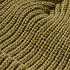 Close up detail of a sage green FXD CP-10 Solid Beanie (FX72509031) OSFM with a brand logo badge on a white background.