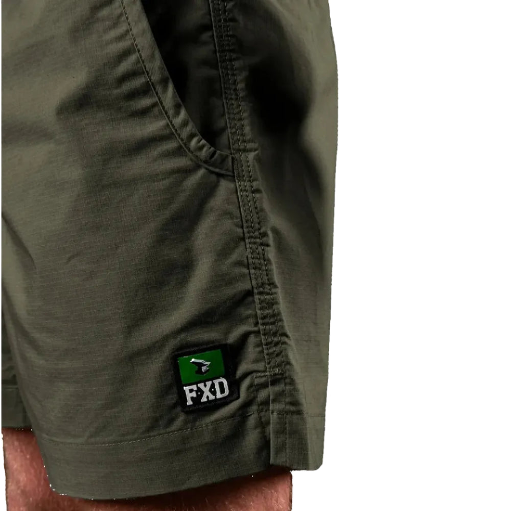 Close-up of green FXD Men's WS-4 Work Shorts (FX02006013) showing a pocket and a black FXD patch.