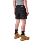 A model from the waist down wearing black FXD Men's WS-6 Work Shorts (FX02306021), black crew socks, and tan work boots against a plain white background.