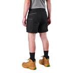 A model from the waist down wearing black FXD Men's WS-6 Work Shorts (FX02306021), black crew socks, and tan work boots against a plain white background.