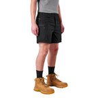 A model from the waist down wearing black FXD Men's WS-6 Work Shorts (FX02306021), black crew socks, and tan work boots against a plain white background.