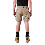 A model from the waist down wearing khaki FXD Men's WS-6 Work Shorts (FX02306021), a black tee, black crew socks, and tan work boots against a plain white background.