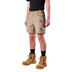A model from the waist down wearing khaki FXD Men's WS-6 Work Shorts (FX02306021), a black tee, black crew socks, and tan work boots against a plain white background.