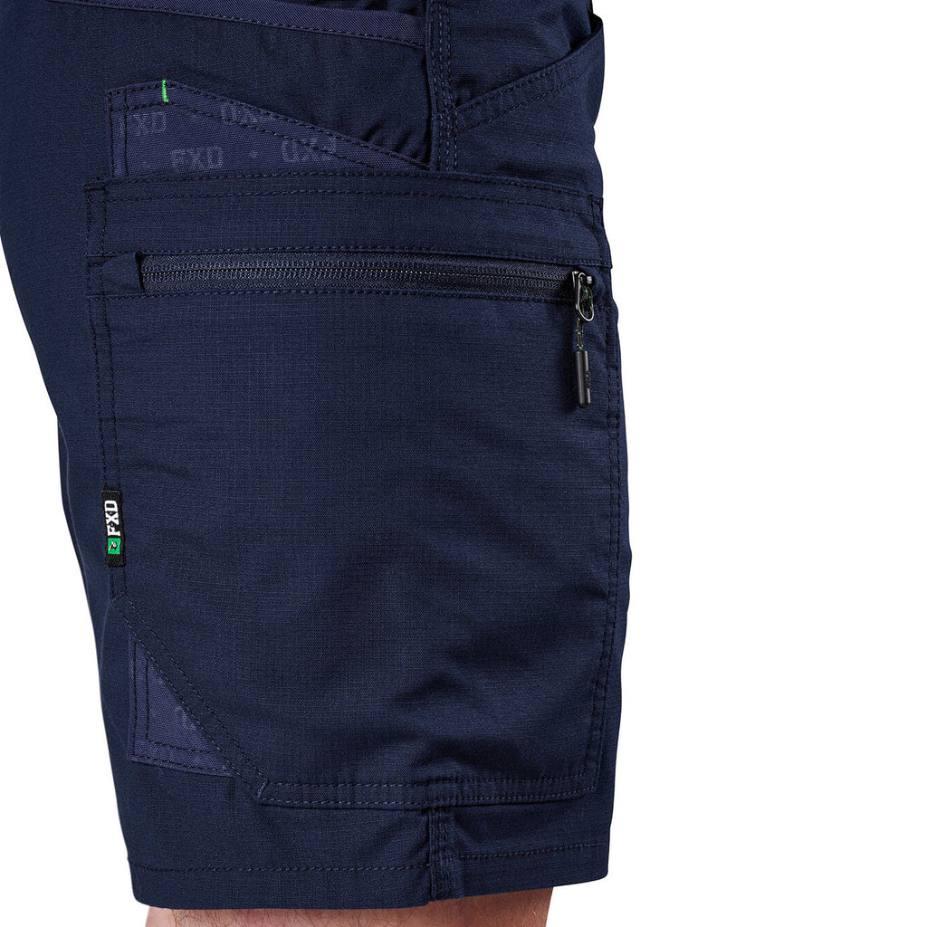Close-up of navy FXD Men's WS-6 Work Shorts (FX02306021, showing  pocket detailing, with a white background on the right.