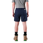 A model from the waist down wearing navy FXD Men's WS-6 Work Shorts (FX02306021), a grey tee, black crew socks, and tan work boots against a plain white background.