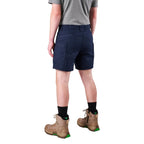 A model from the waist down wearing navy FXD Men's WS-6 Work Shorts (FX02306021), a grey tee, black crew socks, and tan work boots against a plain white background.
