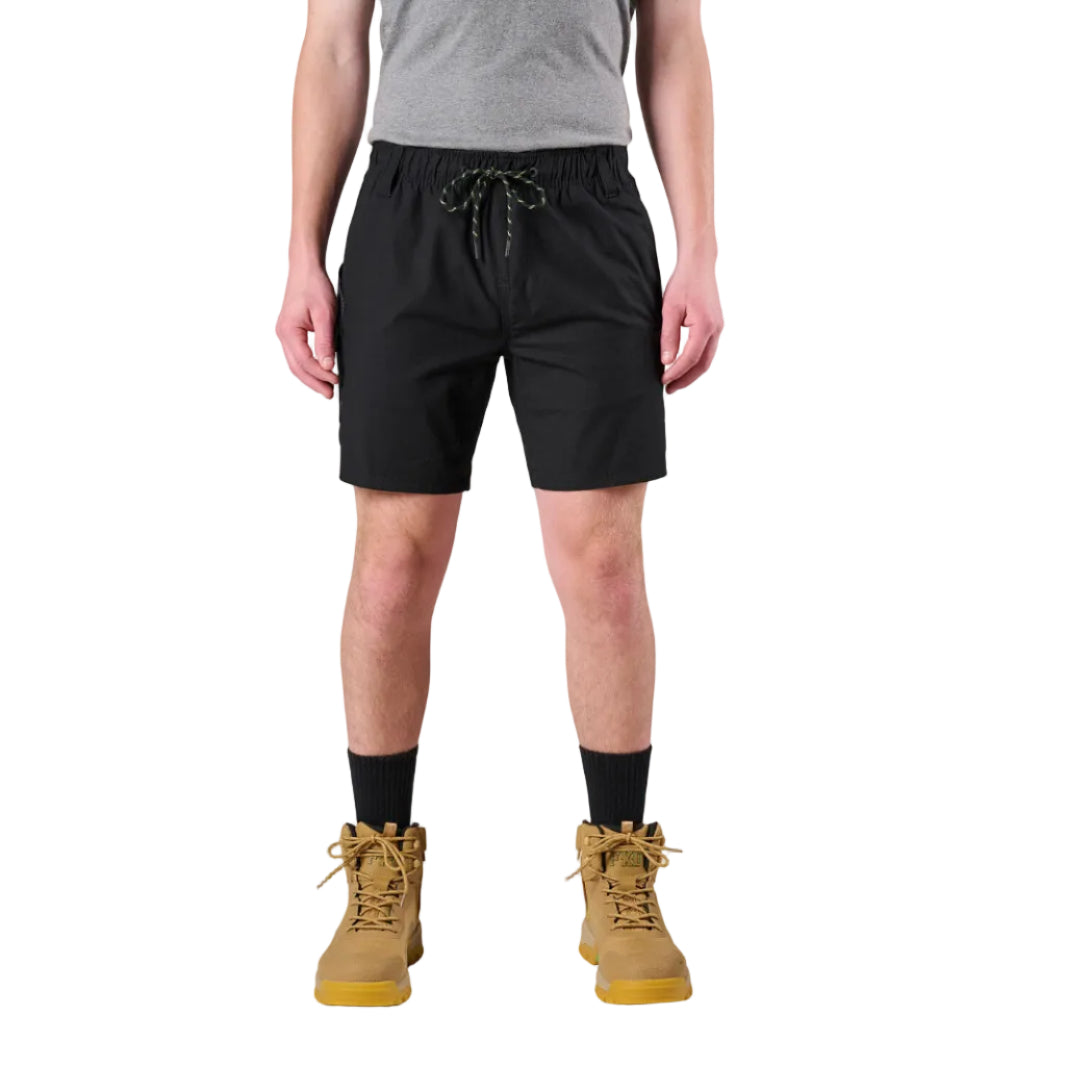 A man modelling black FXD Men's WS-7 Work Shorts (FX02306022) with a grey tee, black crew socks and wheat coloured boots on a white background.