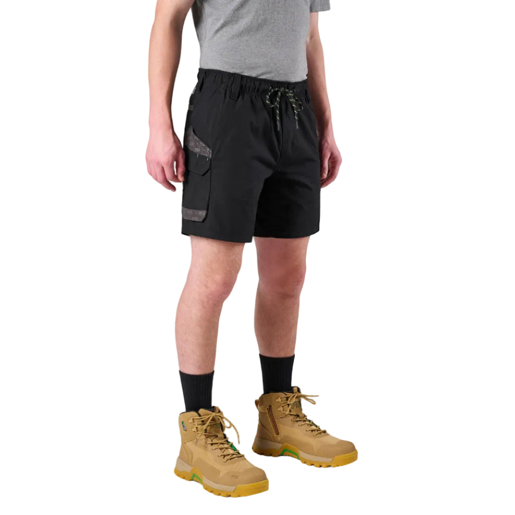 A man modelling black FXD Men's WS-7 Work Shorts (FX02306022) with a grey tee, black crew socks and wheat coloured boots on a white background.