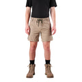 A man modelling khaki FXD Men's WS-7 Work Shorts (FX02306022) with a black tee, black crew socks and stone coloured boots on a white background.