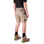 A man modelling khaki FXD Men's WS-7 Work Shorts (FX02306022) with a black tee, black crew socks and stone coloured boots on a white background.