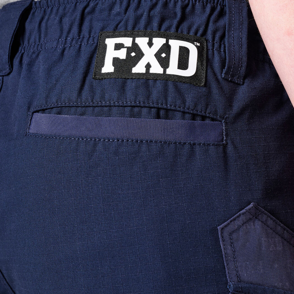 Close-up of navy FXD Men's WS-7 Work Shorts (FX02306022) showing pocket detail an FXD logo patch on the lower waist band.