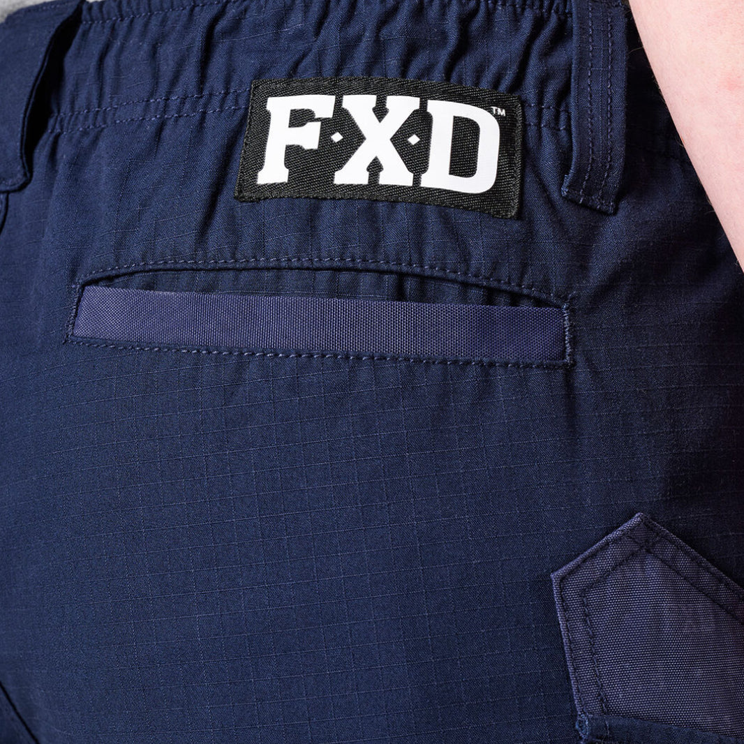 Close-up of navy FXD Men's WS-7 Work Shorts (FX02306022) showing pocket detail an FXD logo patch on the lower waist band.