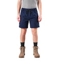 A man modelling navy FXD Men's WS-7 Work Shorts (FX02306022) with a grey tee, black crew socks and stone coloured boots on a white background.