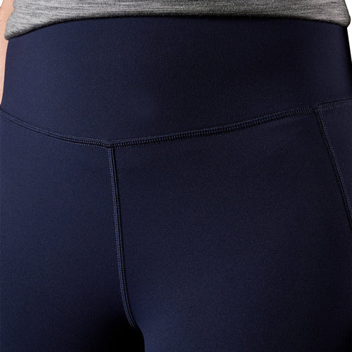 A close up front view of the waist band of a pair of navy FXD Women's Taped Work Leggings (WP-9WT) paired with a grey tee.