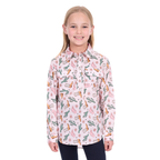 A young girl with straight blonde hair smiles in a Hard Slog Childrens Cleo Half Button L/S Shirt (H6W7101170) Pink and dark pants, standing against a plain white background.