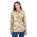 A woman with long brown hair wears the Hard Slog Womens Zia Half Button L/S Shirt (H6W2101180) in green by Hard Slog, paired with blue jeans. She smiles and stands against a plain white background.