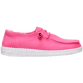 The Hey Dude Womens Wendy Stretch Canvas Slip On Shoes in Fandango Pink feature a bright pink washed canvas upper, white speckled sole, elastic laces, and low profile design, shown from the side against a plain white background.