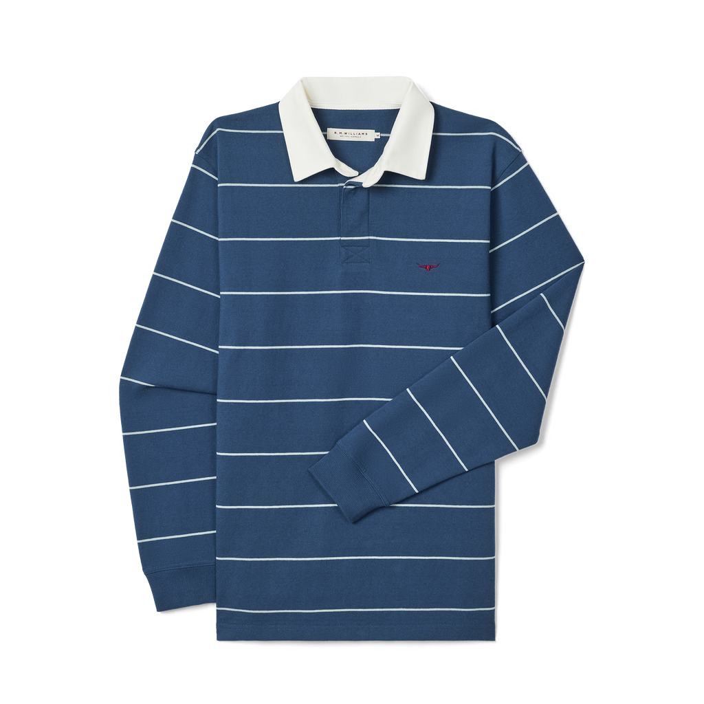 The R.M.Williams Mens Albany Stripe Rugby (KR200RJ17) in vintage blue, made from Australian cotton, features long sleeves, a classic striped design, white collar, and a red embroidered logo on the chest. Laid flat on a white background.