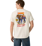 A man faces away from the camera in a Levi's Mens Graphic S/S Tee (16143-2372) Archival Overalls 2 Egret, featuring a vintage graphic of two men tugging on jeans with the text: "Twice the wear in every pair!.