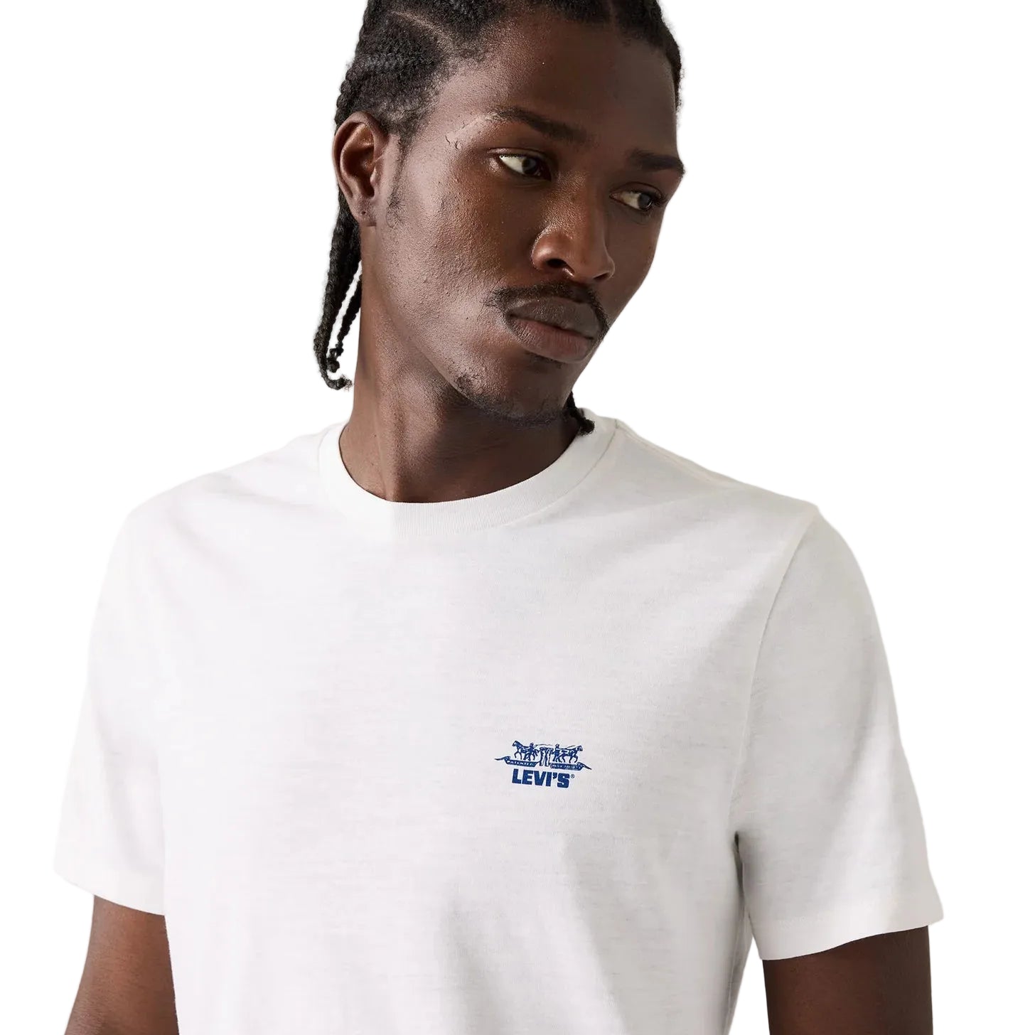 A man wearing a white short-sleeve crewneck t-shirt with a small blue embroidered Levi's logo on the left chest, photographed against a white studio background.