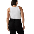 A woman shown from the back wearing a white ribbed tank top and black pants against a white studio background.