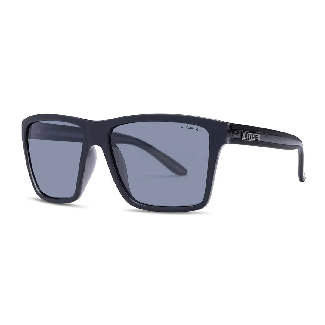 3-4 view of a pair of Liive Vision Bazza Sunglasses (L0670A) with matte black frames and smoke lenses, shown on a white background.