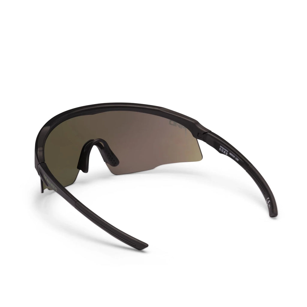 A back view of a pair of Liive Vision Dose Sunglasses (L0805A) with a matte black frame and a large shield-style lens featuring a green mirrored finish, shown on a clean white background.