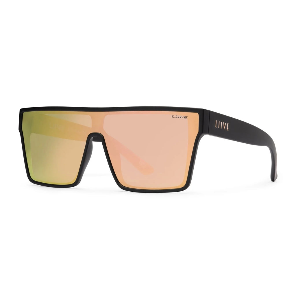 A 3-4 front view of a pair of Liive Vision Wasteland Sunglasses (L0828B) with matte black frames and mirrored pink lenses, shown against a plain white background.