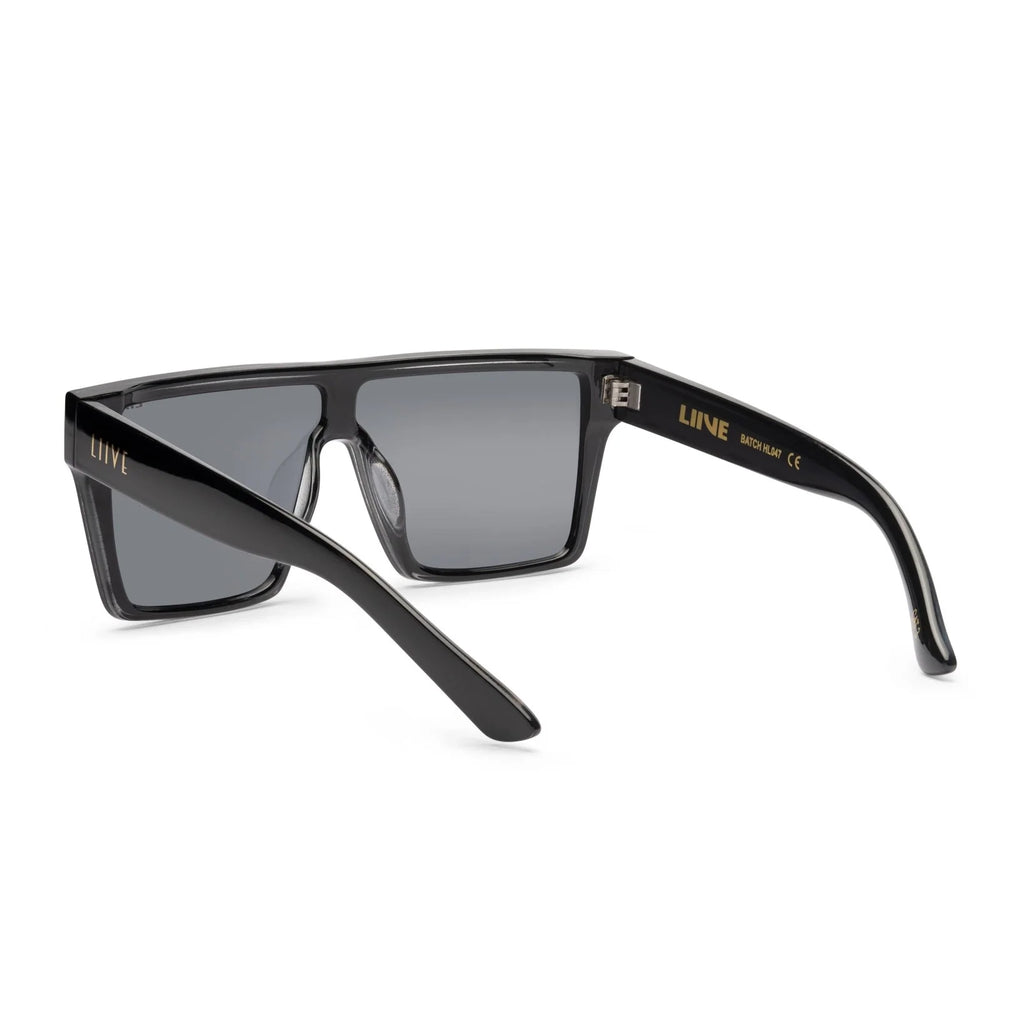 3-4 back view of Black Liive Vision Wasteland Sunglasses (L0828C) with large mirror gold lenses and 'LIIVE' branding on the temple, shown on a white background.