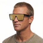 A headshot of a man modelling a pair of Black Liive Vision Wasteland Sunglasses (L0828C) with large mirror gold lenses and 'LIIVE' branding on the temple, shown on a white background.