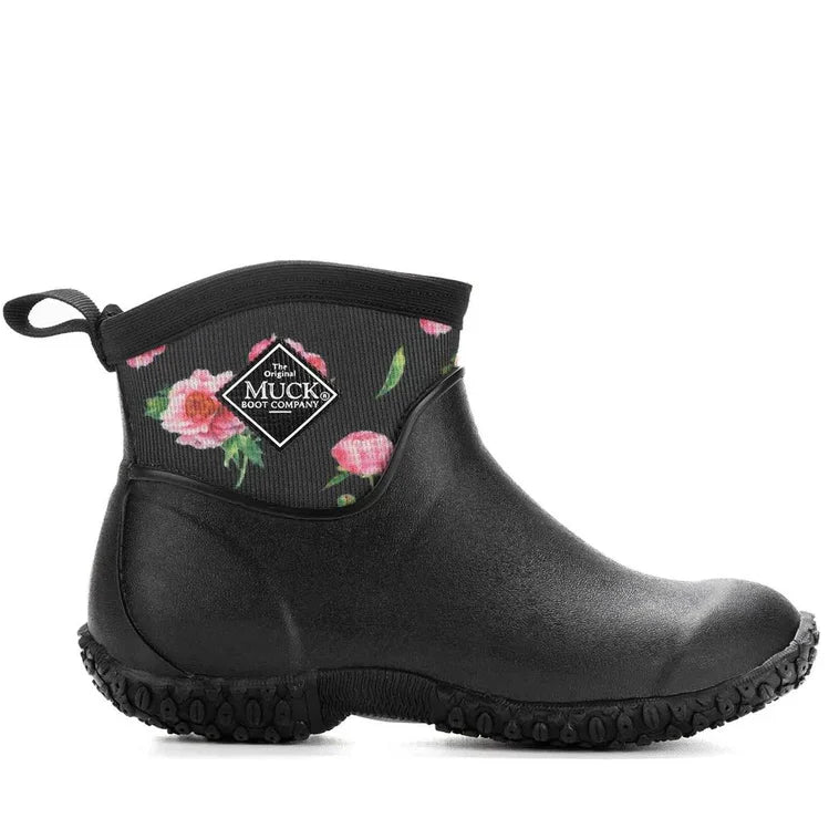 The Muck Boots Womens Muckster II Ankle Boots (MM2AW1ROS) in Black/Roses feature a floral upper with pink roses, a textured sole, pull tab, diamond-shaped logo, and offer lightweight, waterproof comfort—ideal for gardening.