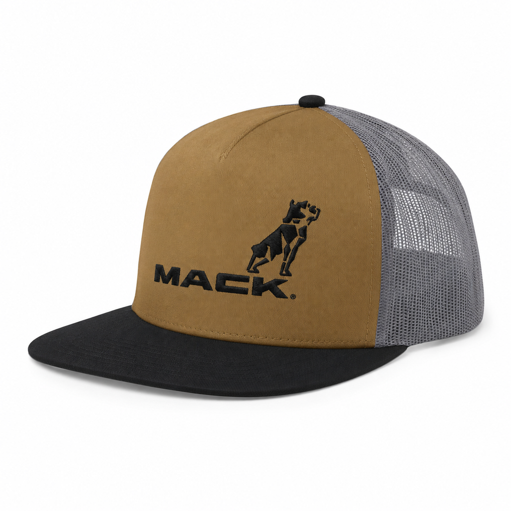 A trucker-style Mack Firm Flat Brim Foam Tri Colour Trucker (MKFBF2402T30000) with a tan front panel, black flat brim, and steel grey coloured mesh back panels. The front panel features a black embroidered dog silhouette above the word 'MACK'.
