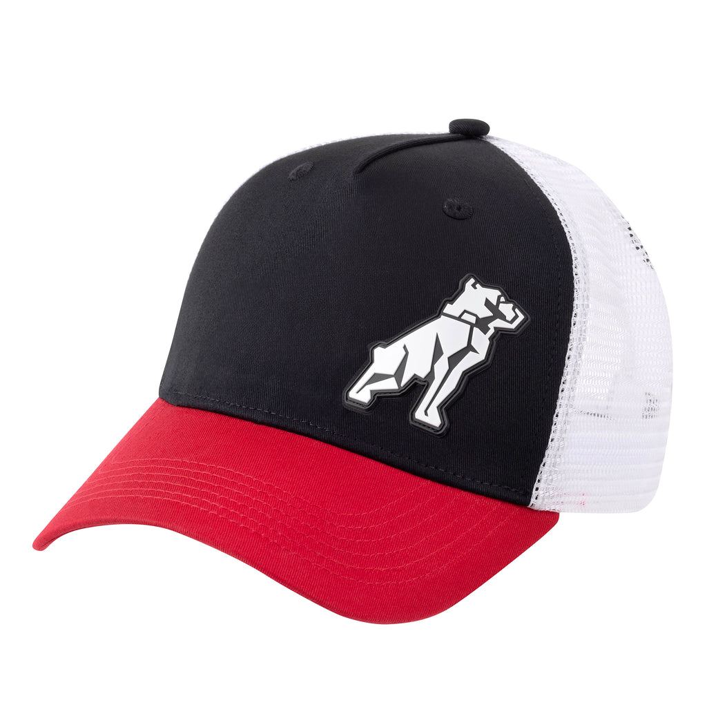 A trucker-style Mack Tri Coloured Curved Trucker Cap (MKBAM2402B50000) with a black front panel, white mesh back, and red curved brim. A white dog silhouette patch is embroidered on the front panel.