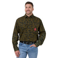 A man wearing a long-sleeve button-up shirt with an all-over dark brown green and black pattern, paired with blue jeans and a black belt, against a white studio background.