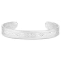 The Montana Silversmiths Out West Cuff Bracelet (BC6063) features intricate engraved floral and swirl patterns on a tarnish-resistant silver cuff, beautifully displayed on a white background.