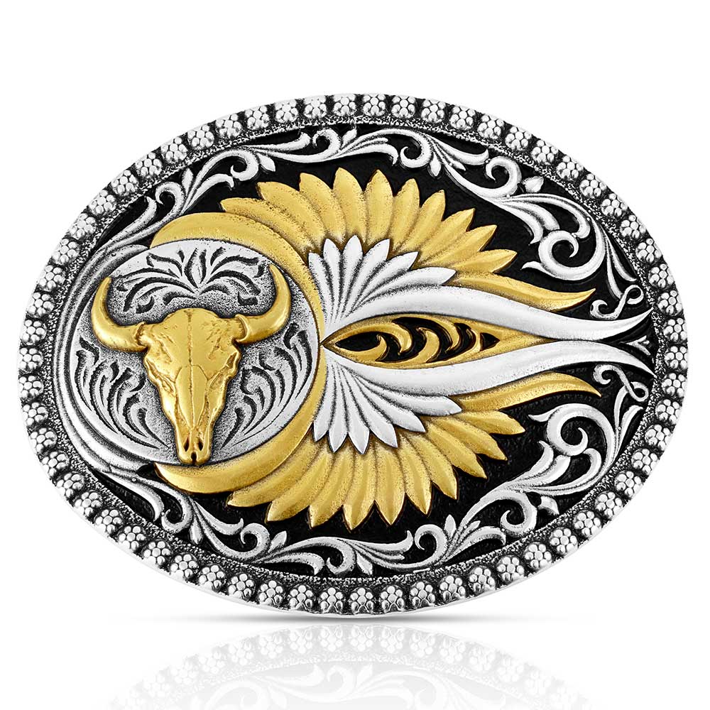 The Montana Silversmiths Sturgis Attitude Buckle (A1039P) features a gold buffalo skull motif, stylized gold and silver feathered wings on black, and detailed silver scrollwork along the edges.