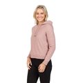 A blonde woman smiles while wearing the Native World Womens Cropped Hoodie (NB888) in Lily and black pants, standing against a white background.