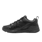 Side view of a black New Balance Men's 608 v5 Slip Resistant Shoes (MX608BB5) shown from the side against a white background.