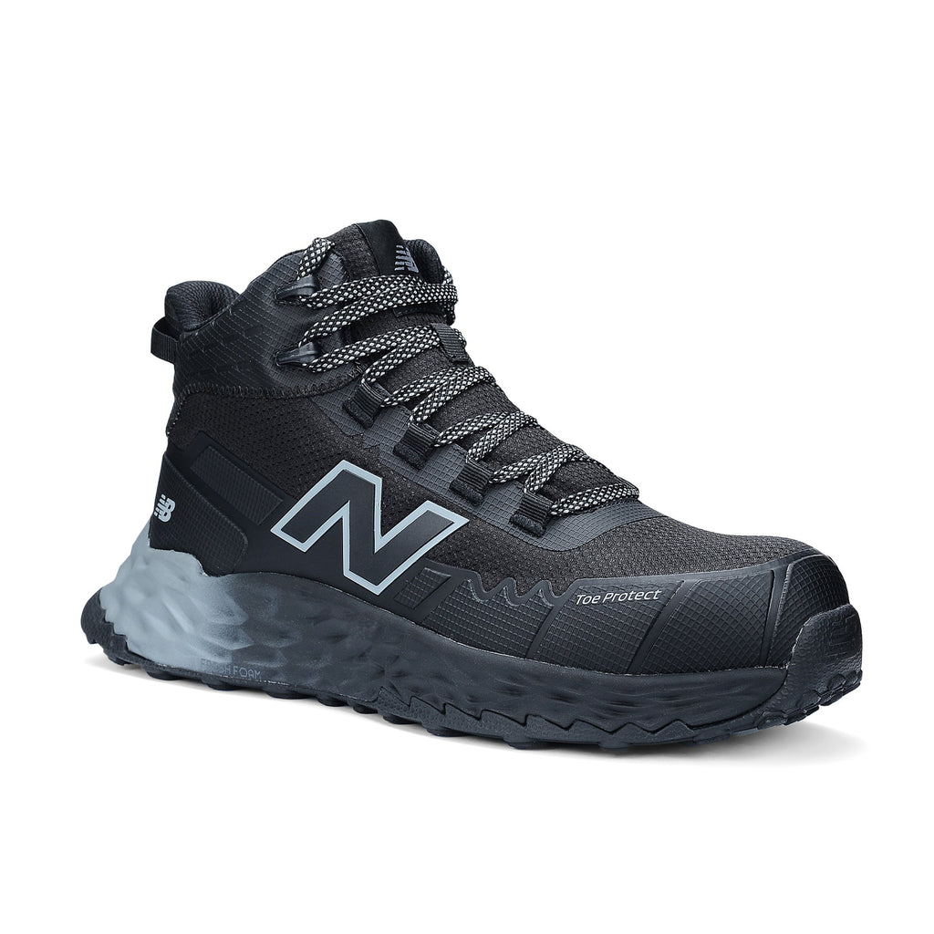 3-4 front view of a black and grey New Balance Men's Cremorne Mid Cut Safety Sneaker (MEFCMCAPBG) with logos on a white background.
